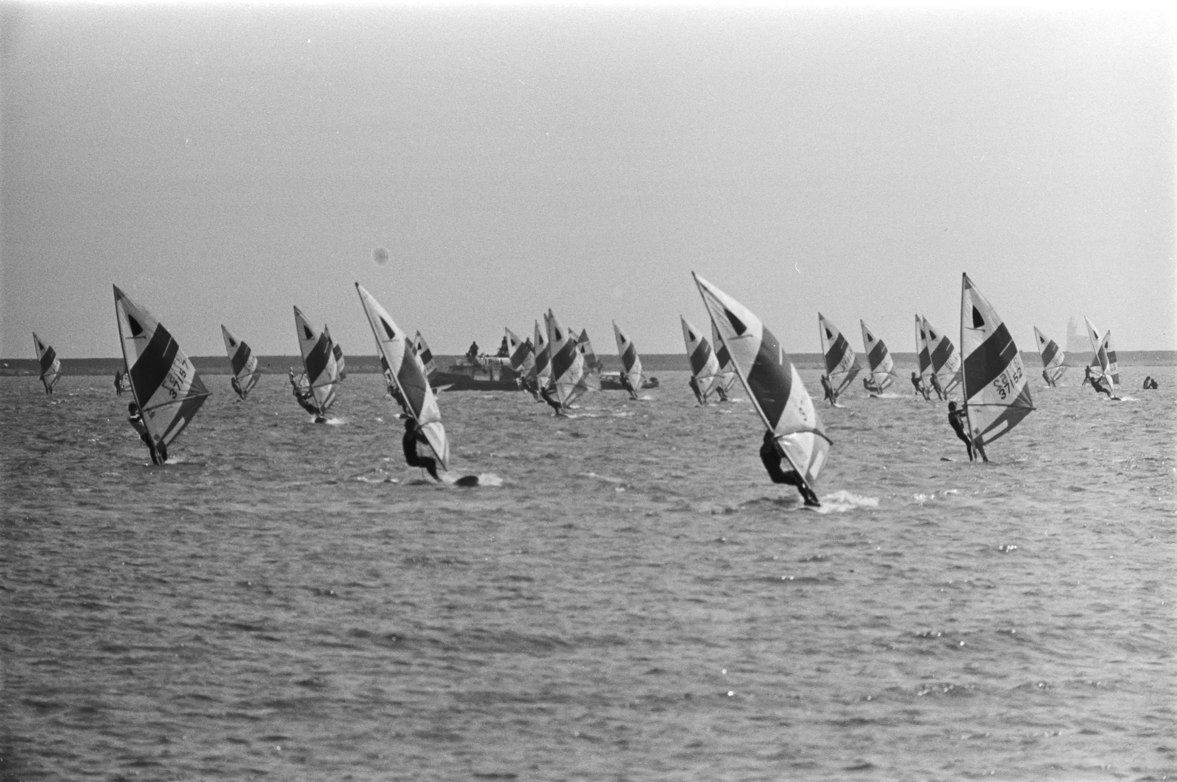 Windsurfers with striped sails racing on the Gouwzee