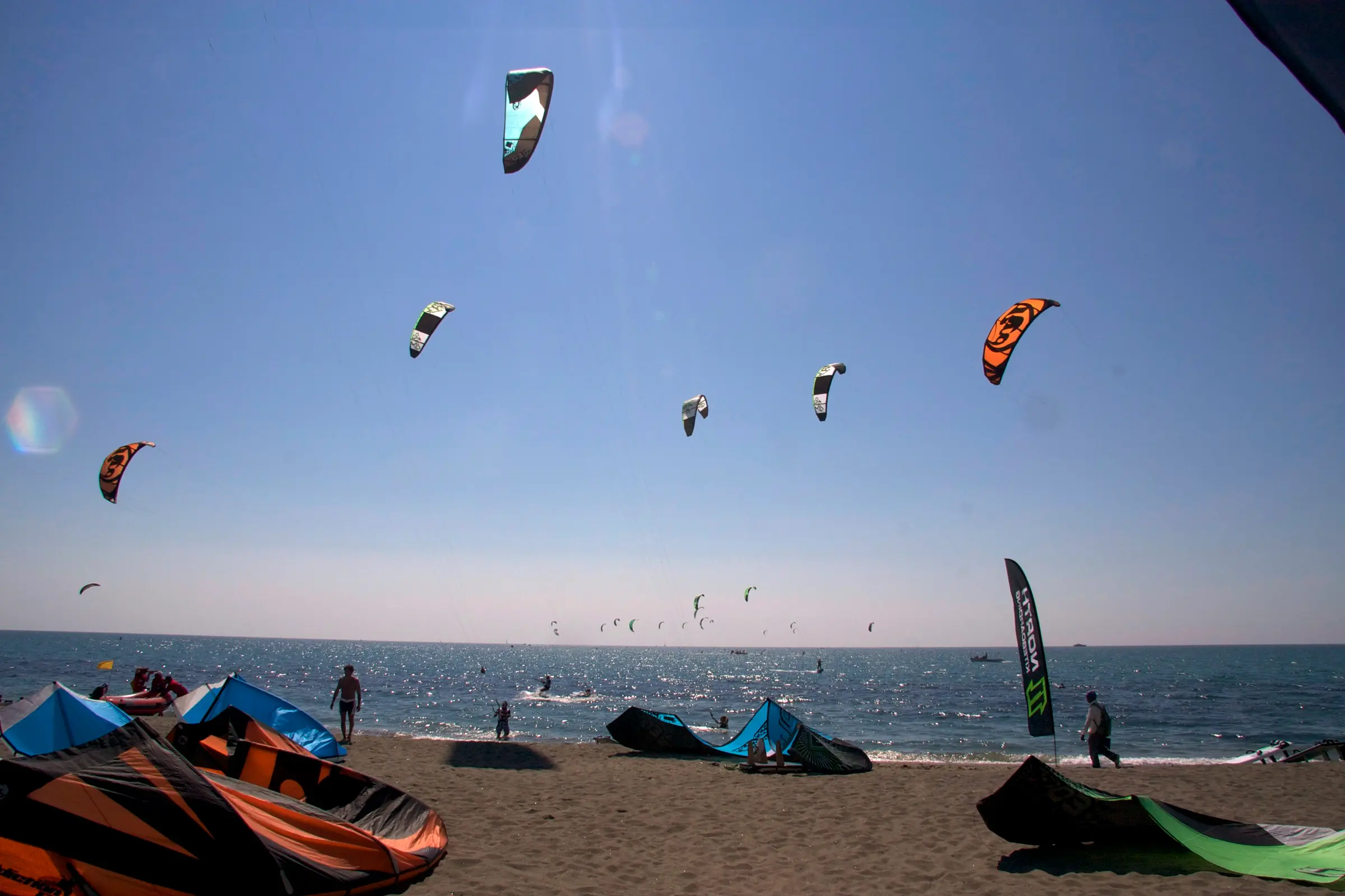 Kite racers on the water off Ostia